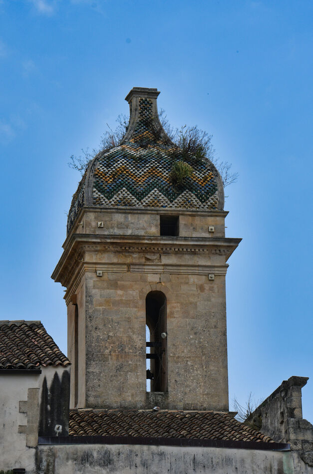 The tiled bell tower of the Church of San Vincenzo...