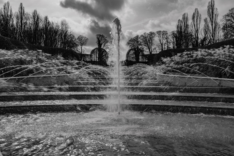 Water fountains, black and white as shot against t...