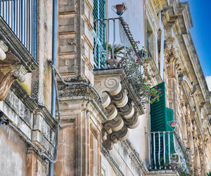 More balconies with intricately carved stone corbe...