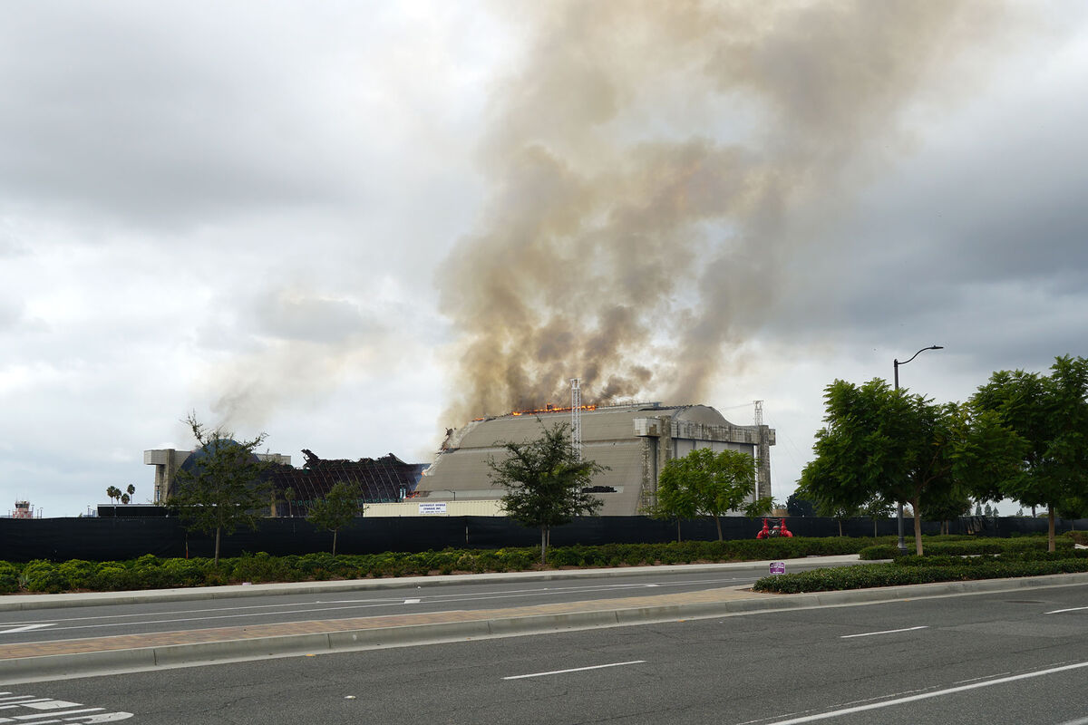 A fire burning one of two former Navy Blimp Hanger...