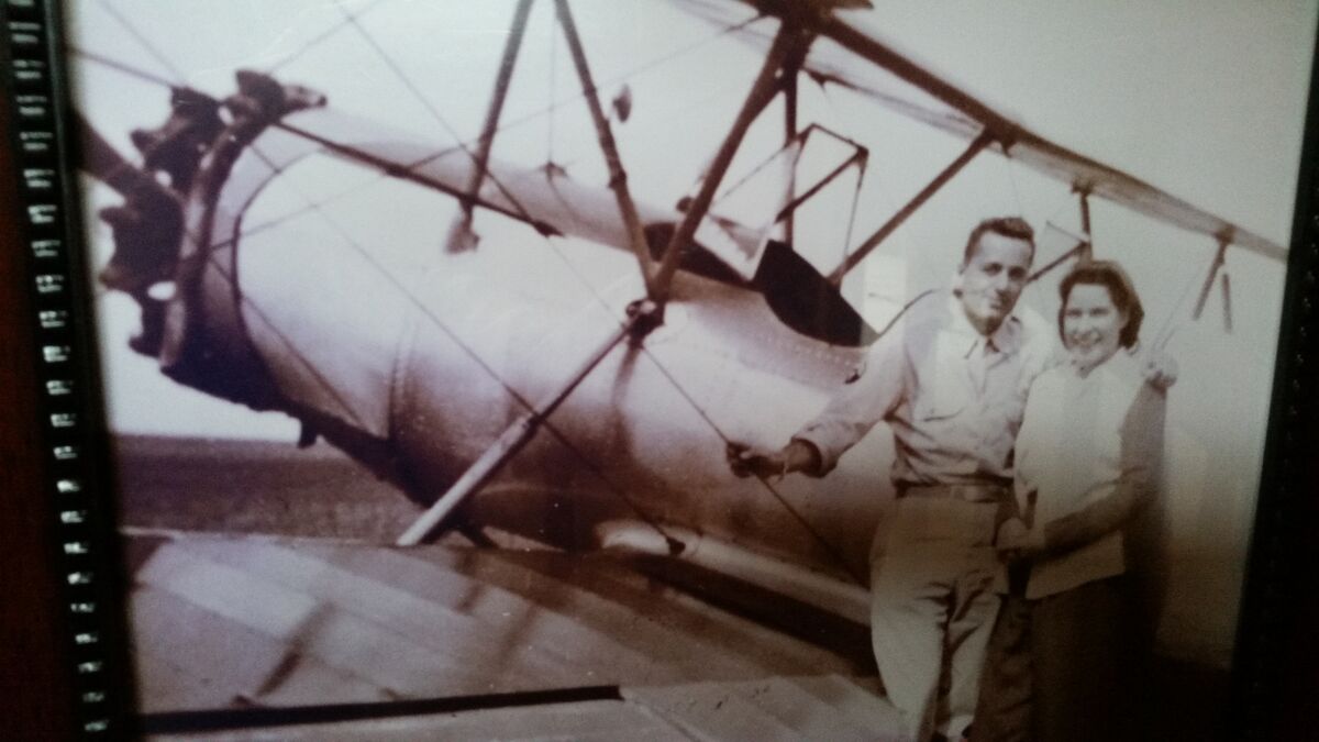 My parents by the biplane she took him up in. You ...