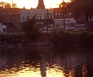 A church steeple, as reflected in the Saginaw Rive...