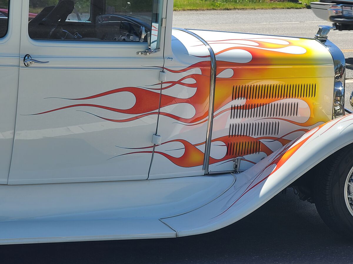 A flame painted on an old car....