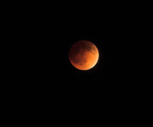 Looking up at the Blood Red Lunar Eclipse, as seen...