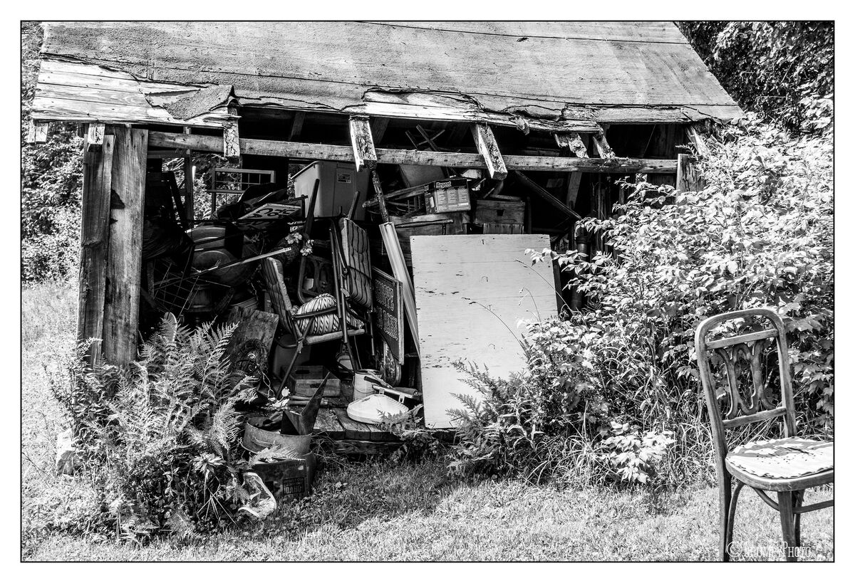 A nice barn that is now an antique store and the old storage shed next ...