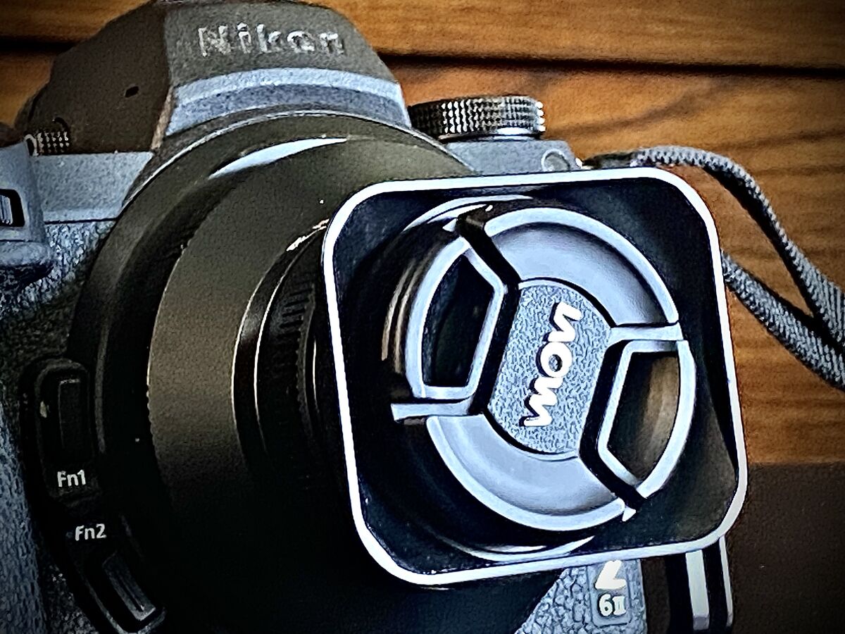 Removing Lens Cap Camera Lens Caps? Do any of you use lens caps? All lenses come with them, but ...